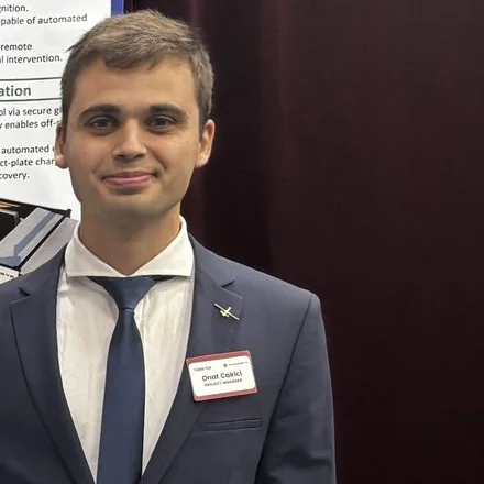 Photo of Onat Cakici, founder of Urban Robotics, in a suit.